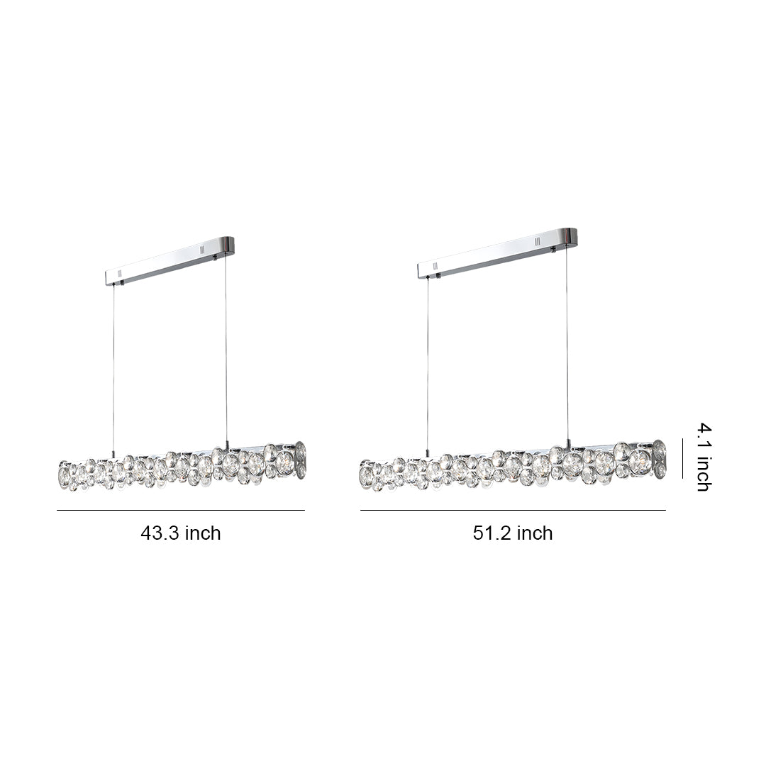 Close-up macro view of the sparkling, oversized round crystal facets on the elegant silver pendant light fixture.