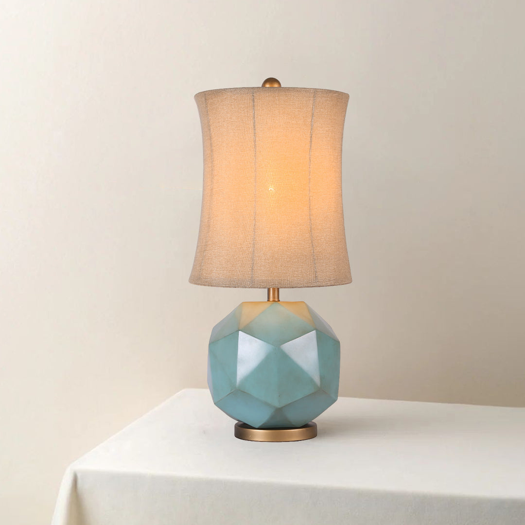 Close-up of the modern industrial table lamps base, showcasing the teal glazed finish and the sturdy geometric construction.