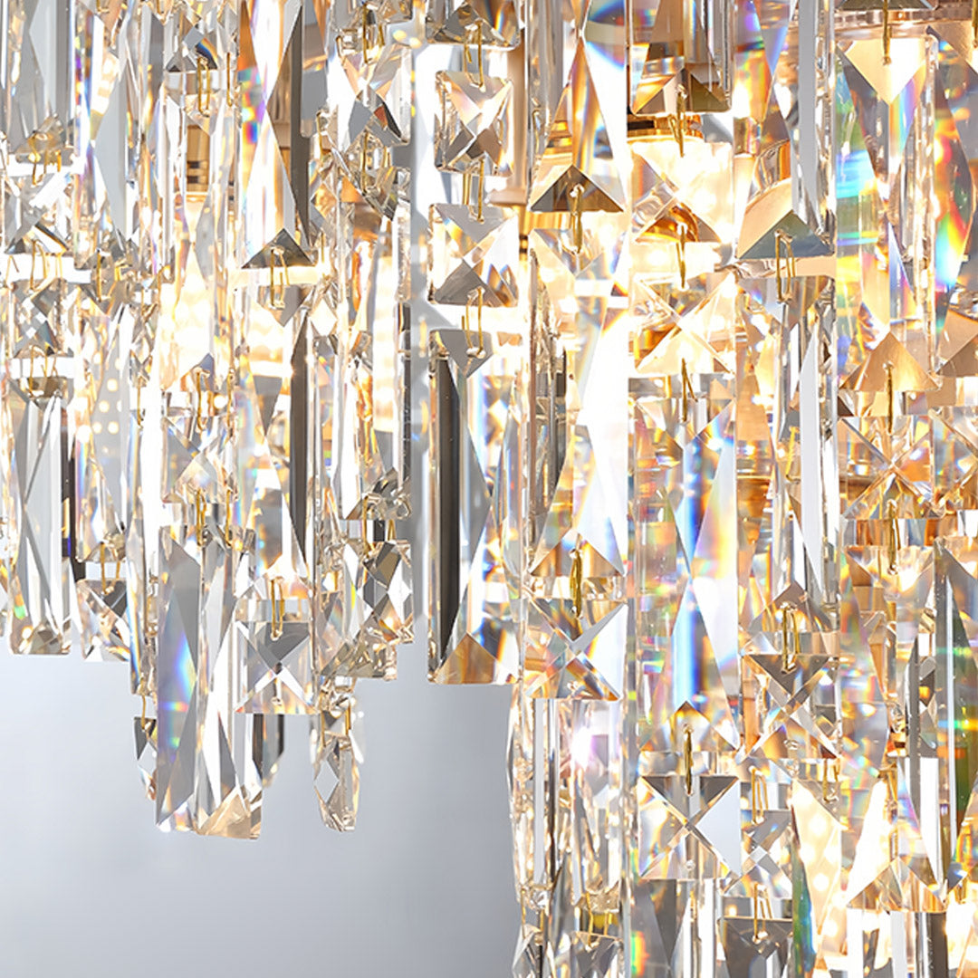 Grand tiered glass chandelier with cascading crystal tiers creating spectacular lighting centerpiece