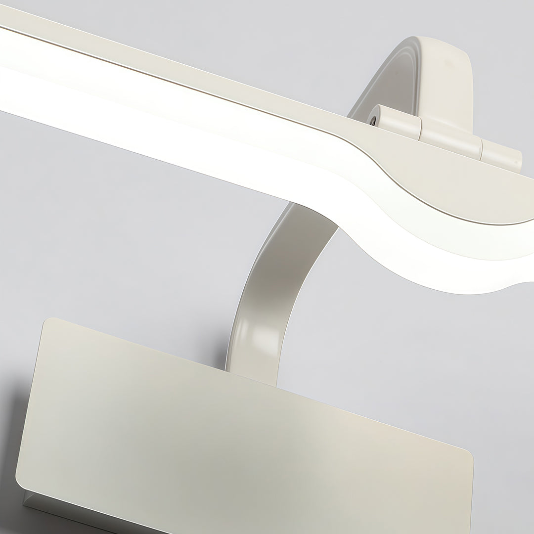 Close-up detail of white bathroom vanity light showing curved LED bar and mounting bracket.