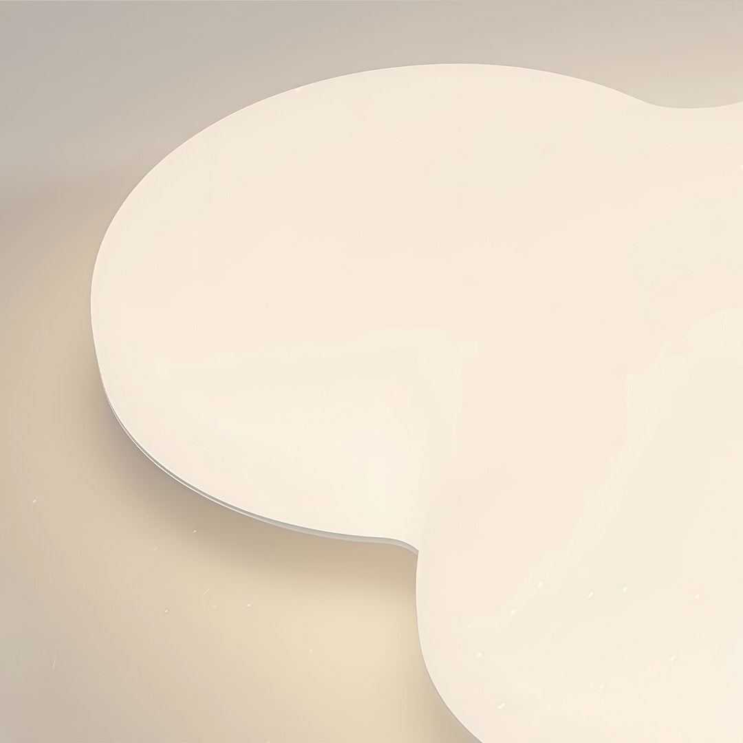 Close-up view of cloud ceiling light surface showing smooth acrylic diffuser texture.