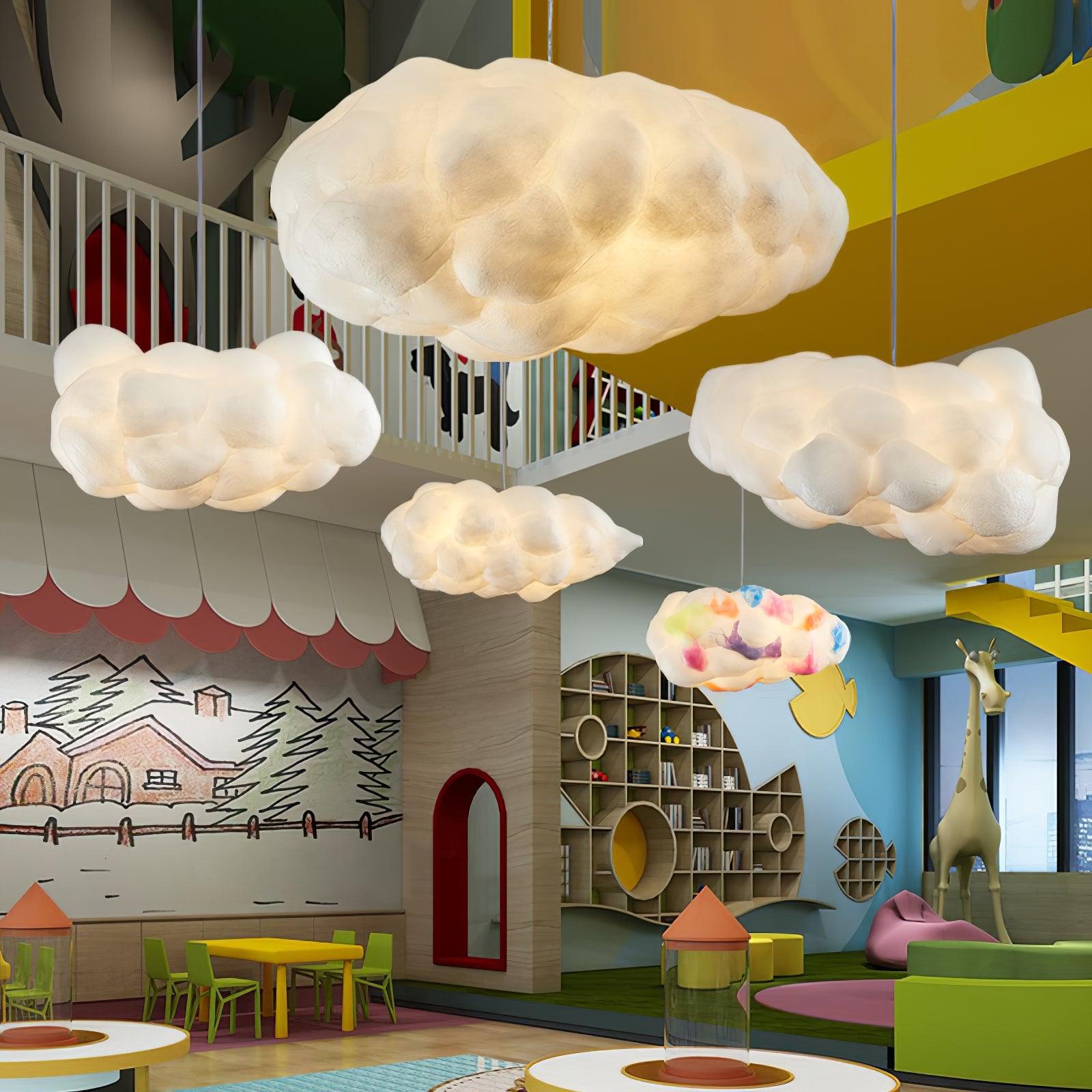 Cluster of cloud-shaped pendant lights in a creative indoor playground space.