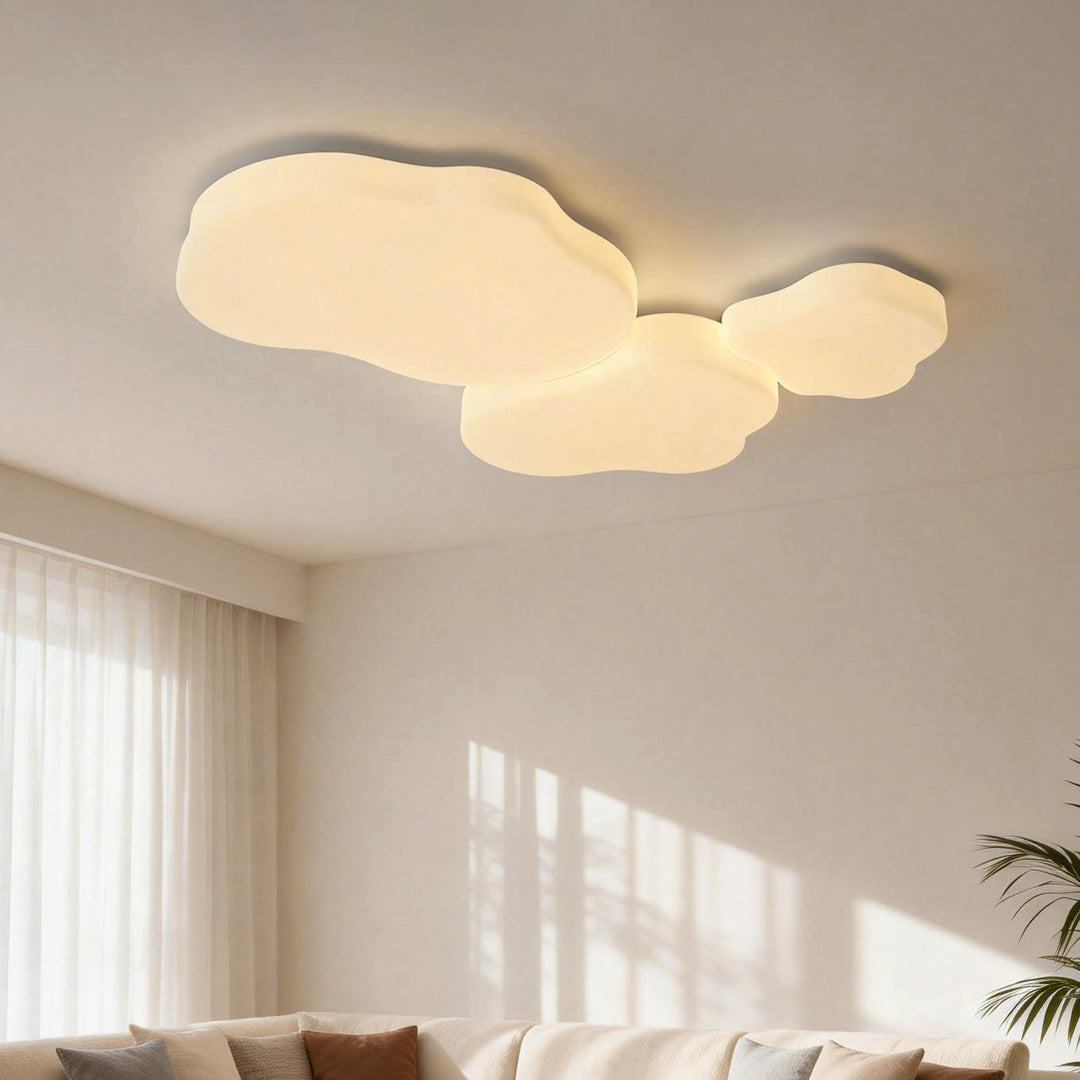 Elegant cloud shaped ceiling light, seamlessly integrated into a modern bedroom, offering ambient lighting with a unique design.