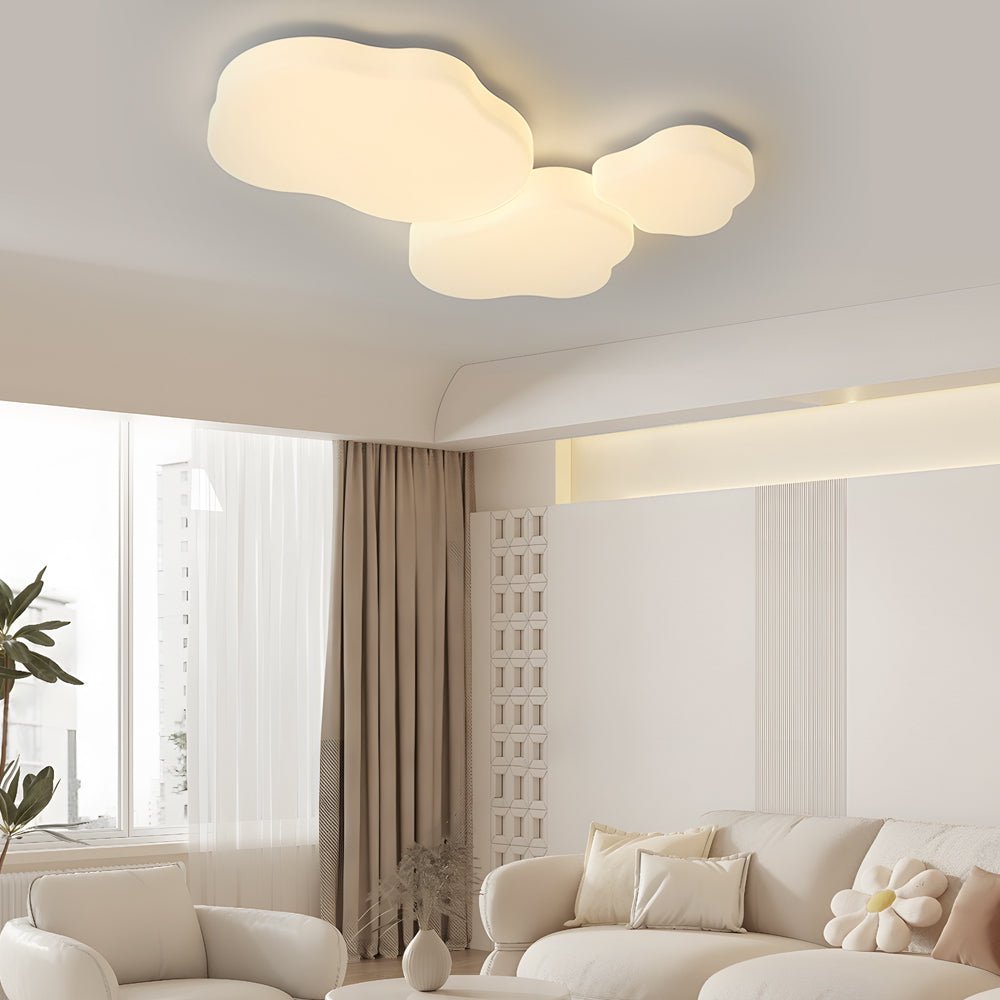 Stylish cloud-shaped ceiling light, creating a relaxing atmosphere in a well-lit living room with contemporary decor.