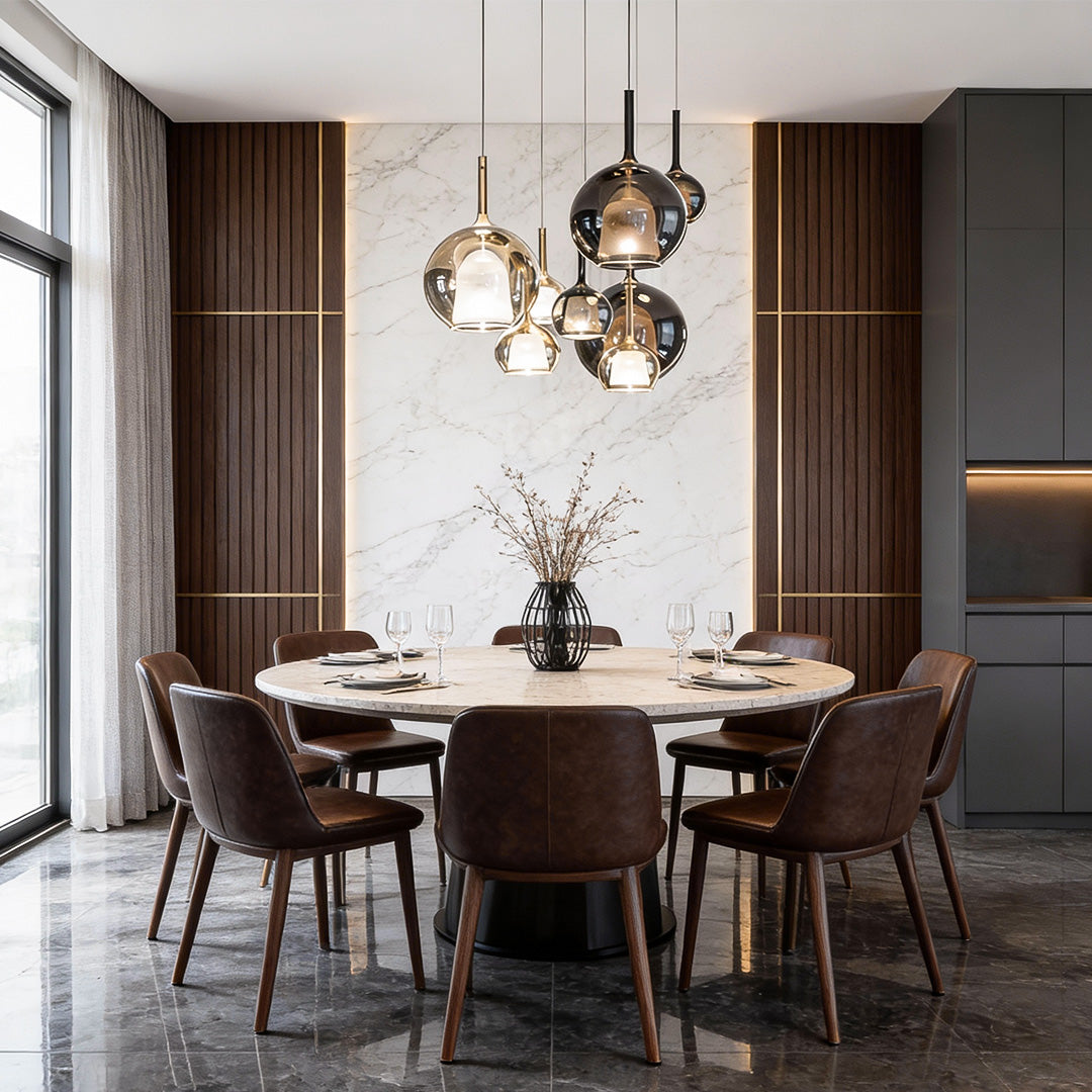 Cluster of glass ball pendant lights hanging above a modern dining table, creating a warm and stylish ambiance.