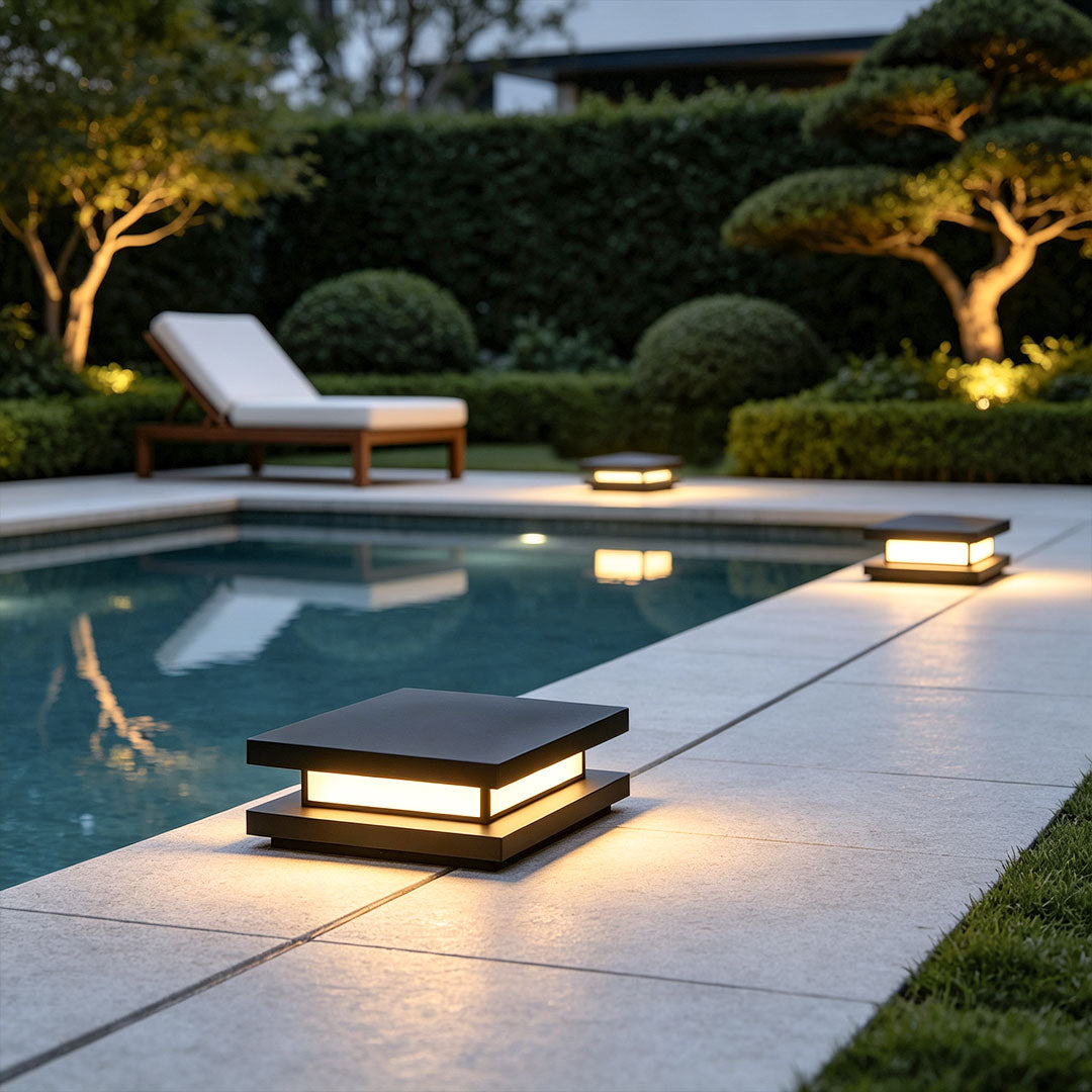 Coastal outdoor patio featuring decorative garden lights with sleek low-profile square design.