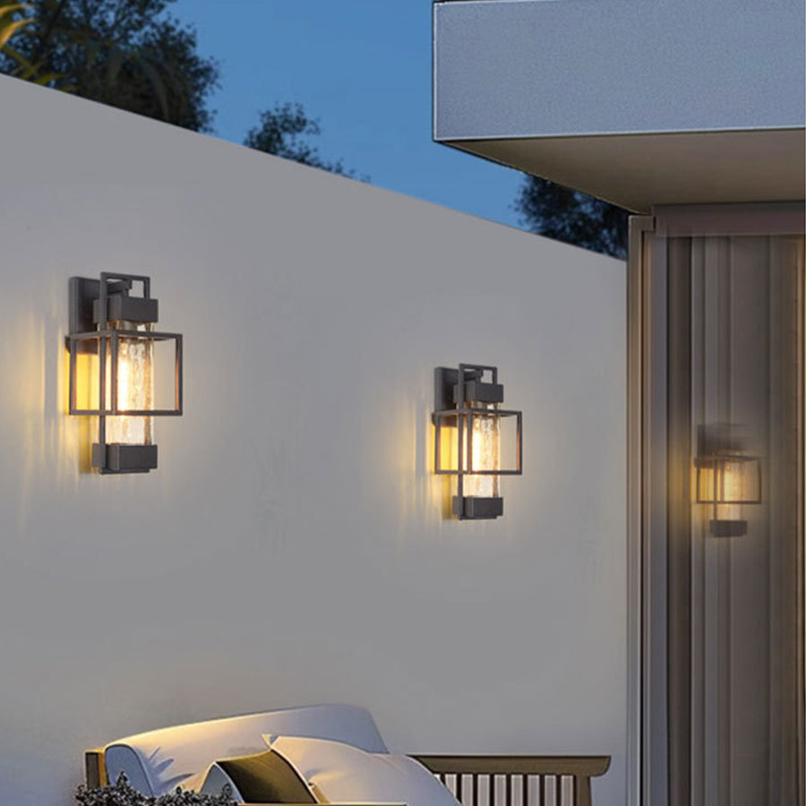 Multiple black outdoor wall lights creating cohesive lighting design across modern building exterior