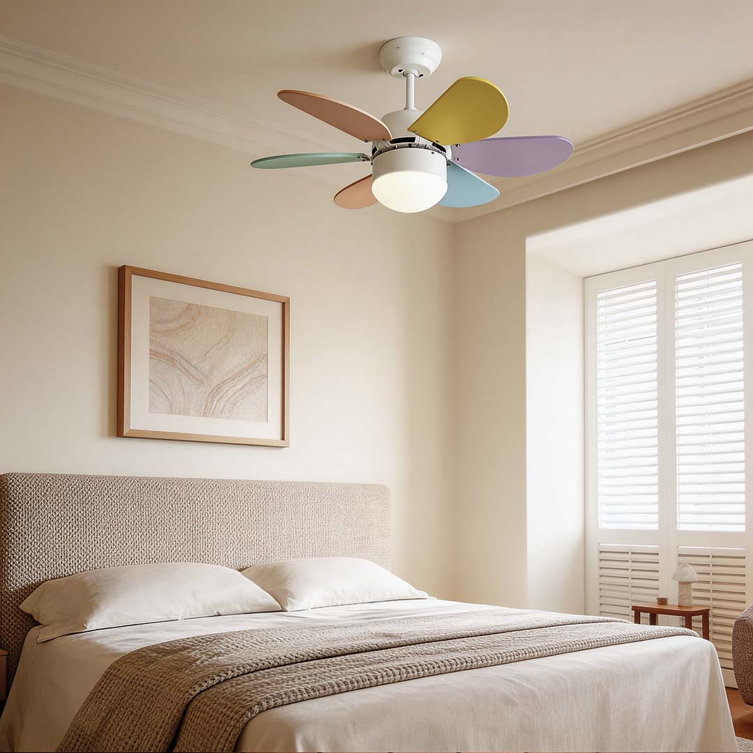 Colored fan with light enhancing a cozy bedroom with vibrant rainbow blades and warm illumination.
