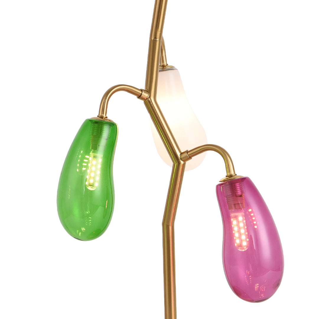 Close-up of colorful glass shades on a modern table lamp.