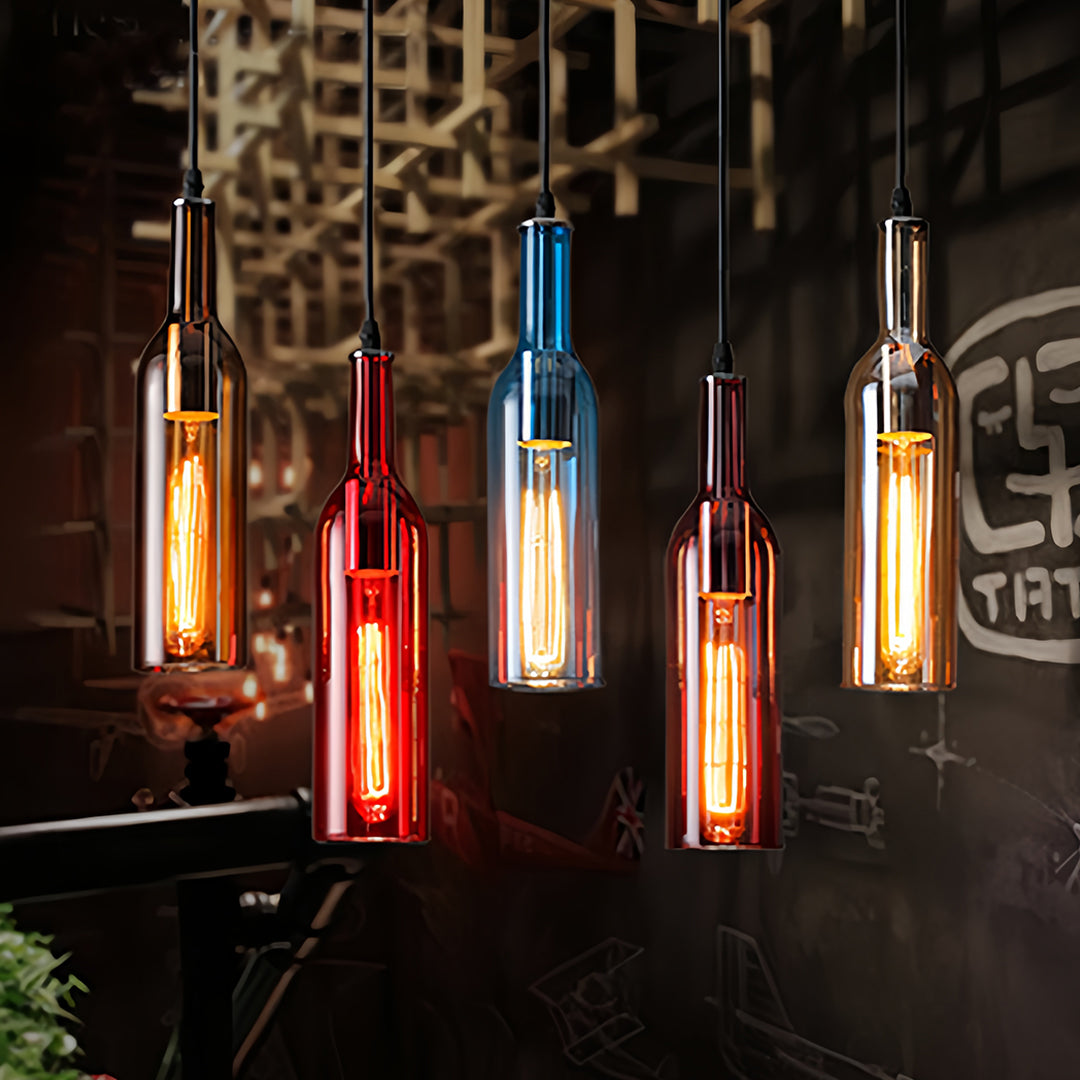 Colorful wine bottle pendant lights illuminating contemporary dark interior space at night