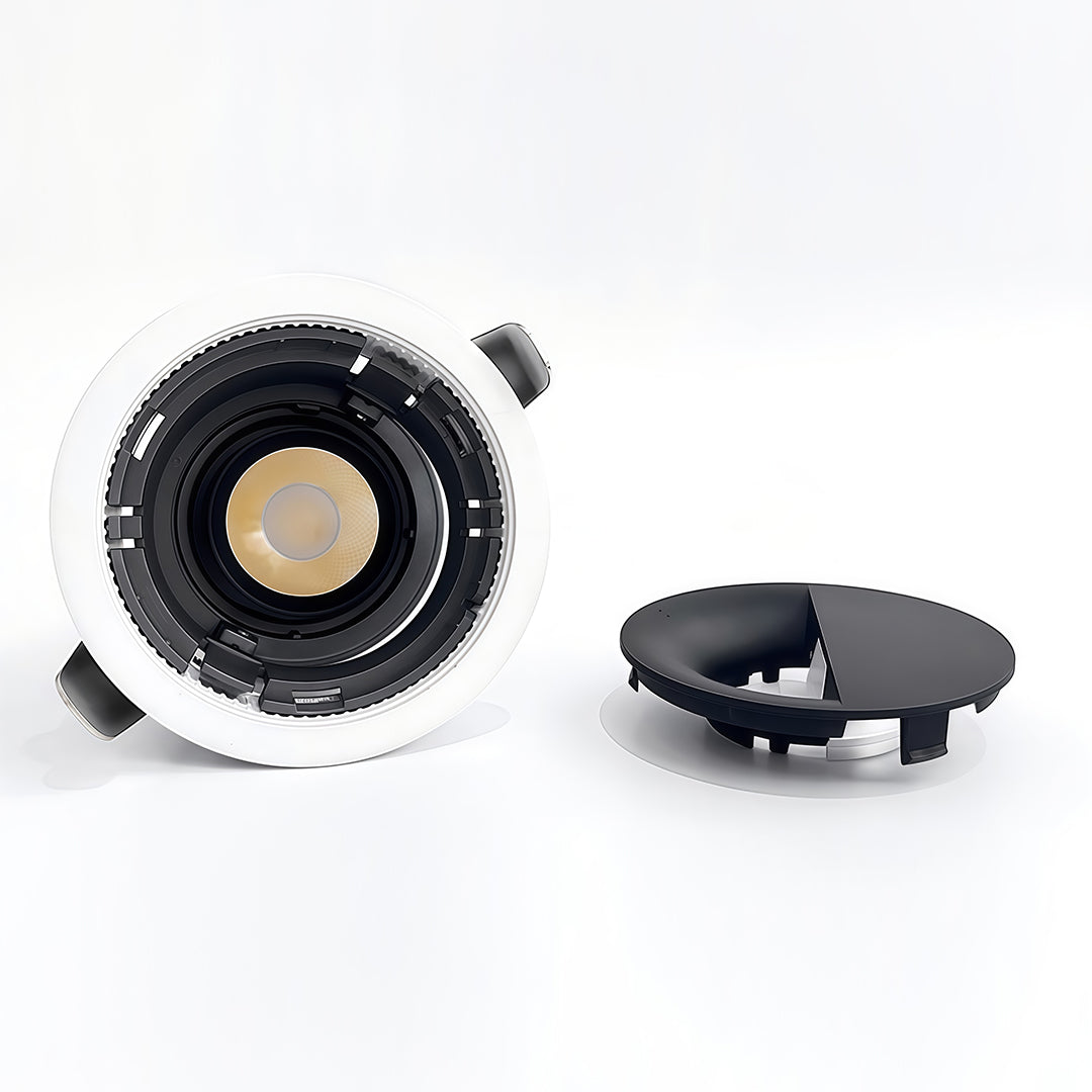 Commercial-grade adjustable spotlights unit showing internal components and glass shade chandelier style light distribution.