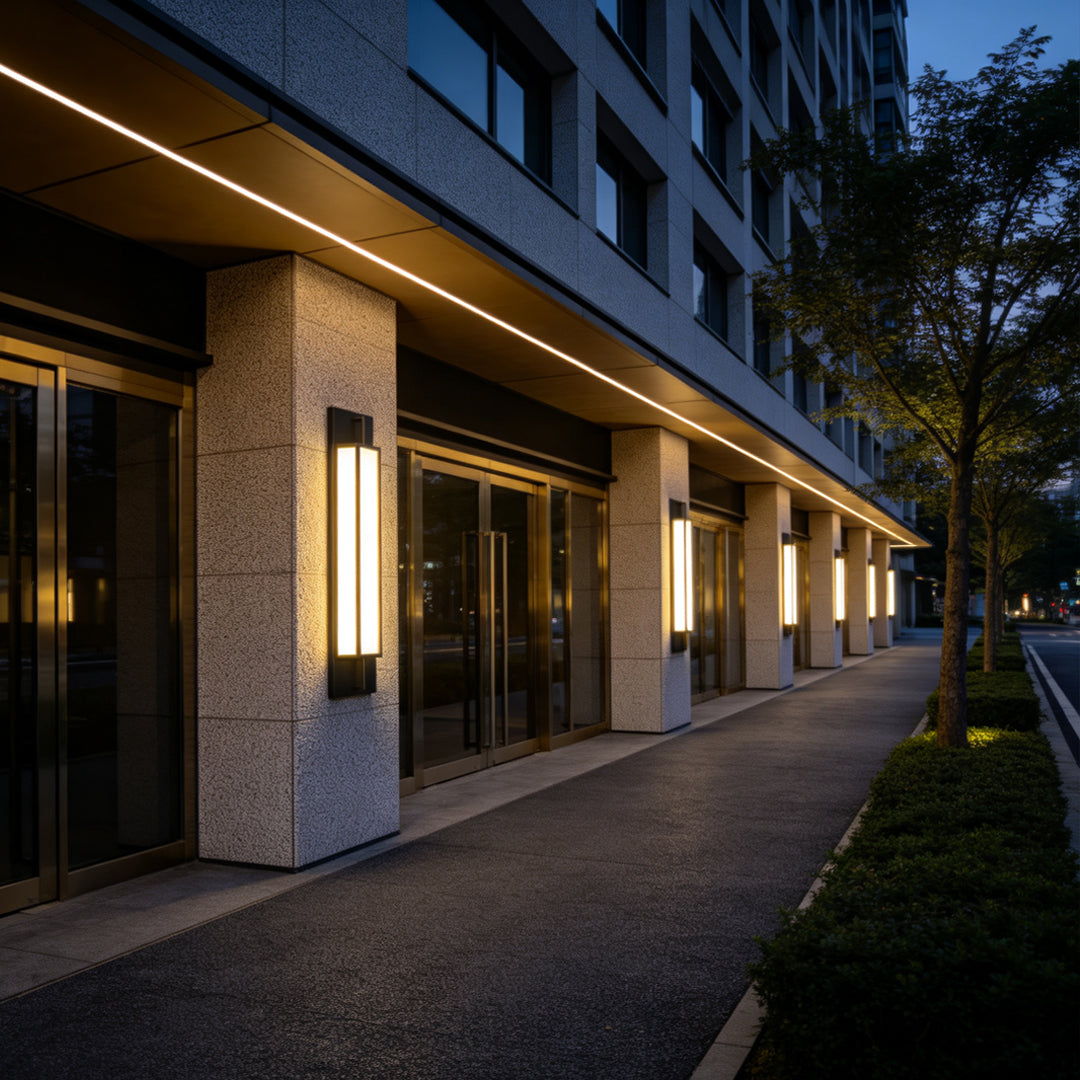 Commercial building exterior lined with minimalist Large Outdoor Wall Light fixtures for modern facade illumination.