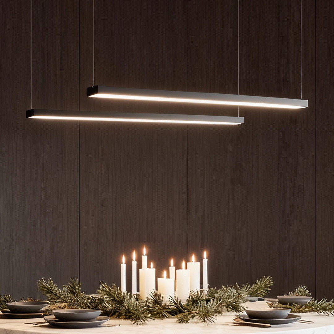 Commercial linear pendant lighting above a contemporary dining area