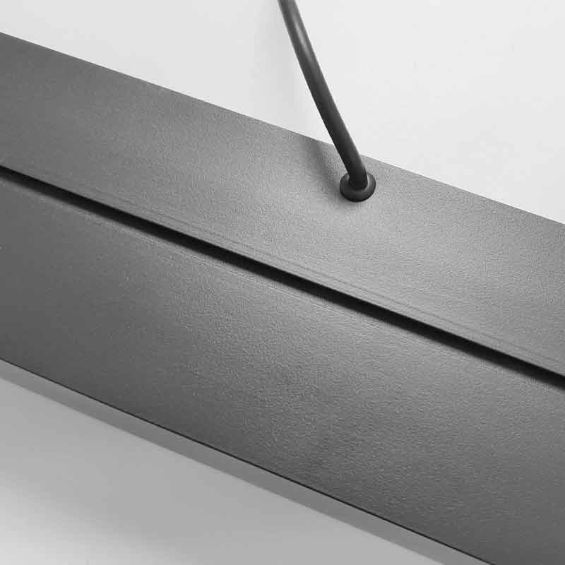 Commercial linear pendant lighting features sleek rectangular LED fixtures designed to deliver efficient, stylish illumination for workspaces.