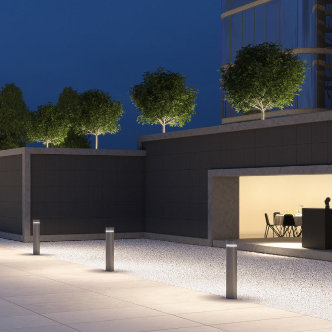 Pathway LED lights creating elegant illumination along modern commercial plaza with architectural lighting design