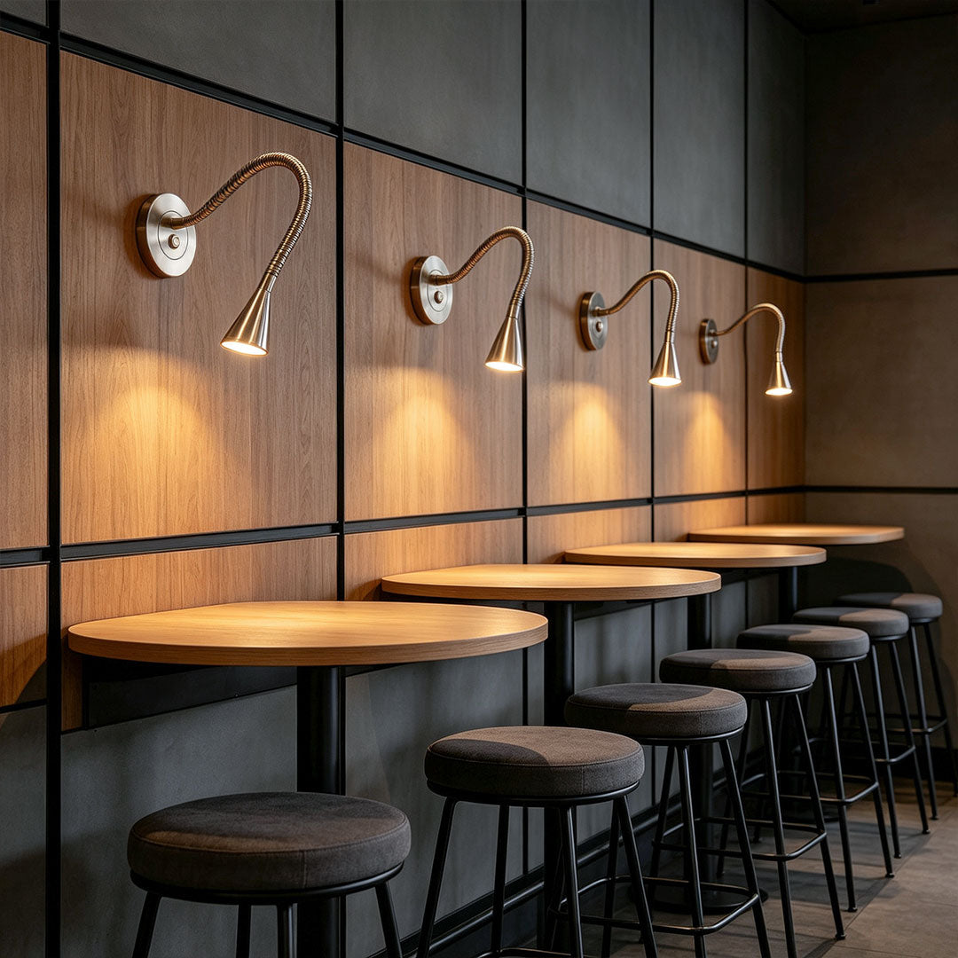 Commercial wall light with swing arm used above restaurant booth seating.