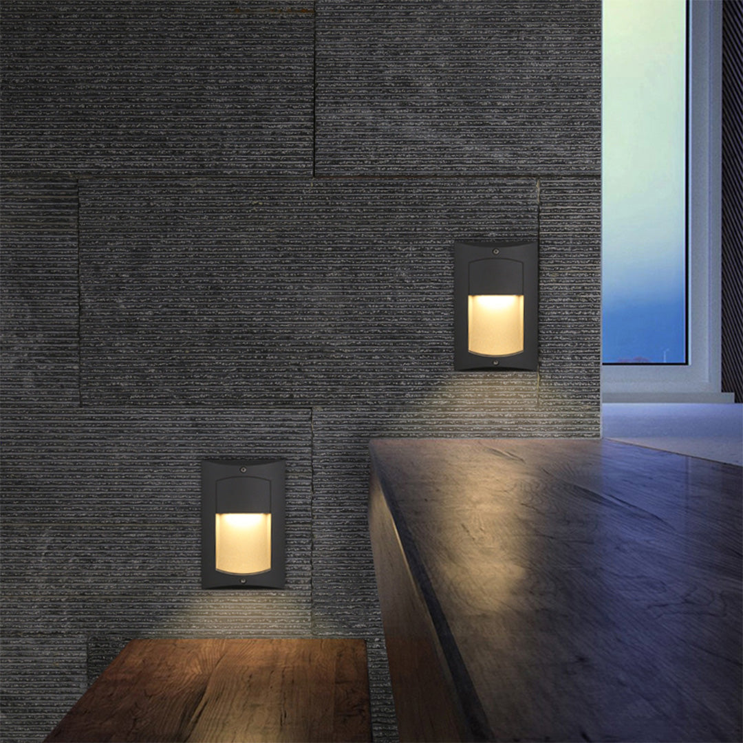 Contemporary recessed wall lighting integrated into concrete garden wall with landscape surroundings