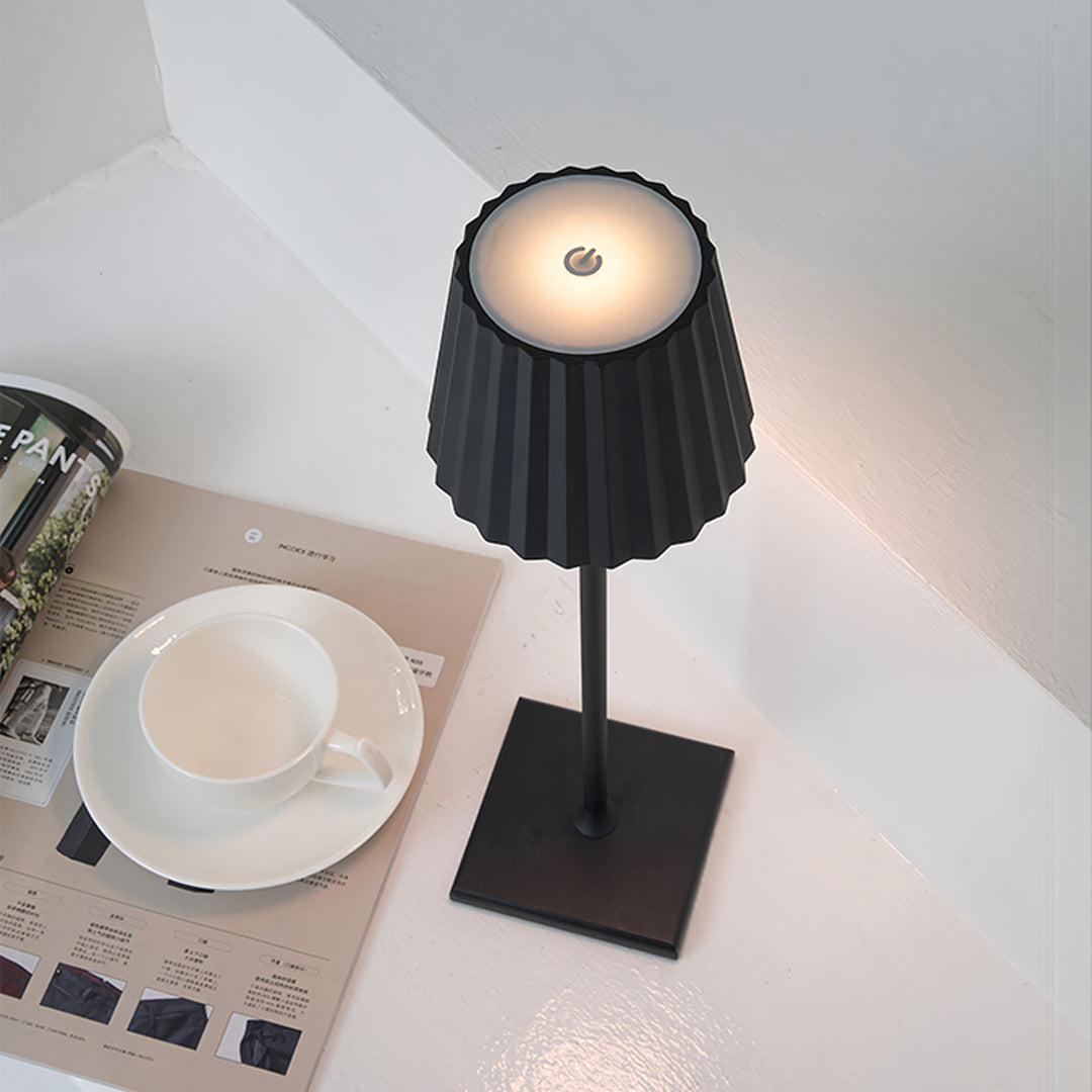 Compact modern metal table lamp with directional lighting perfect for desk and reading applications