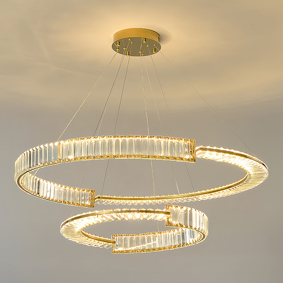 Compact gold crystal chandelier with tiered rings suitable for smaller residential spaces