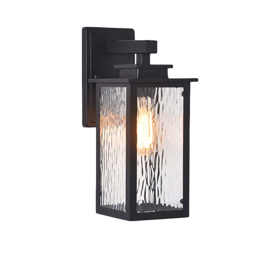 Compact black wall-mounted lantern with Edison bulb providing focused exterior illumination