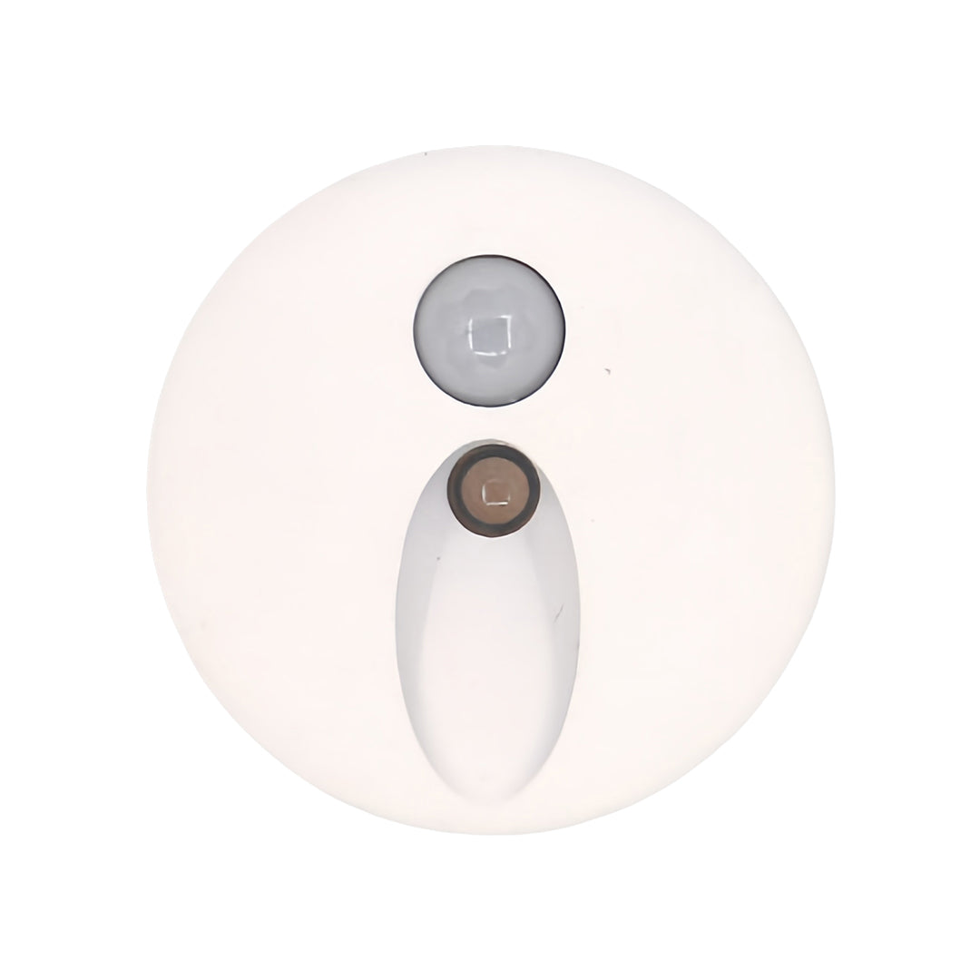 Compact white interior stair step lights with a clean, oval light beam design and built-in sensor, ideal for subtle, energy-efficient path lighting in modern hallways and stairwells.
