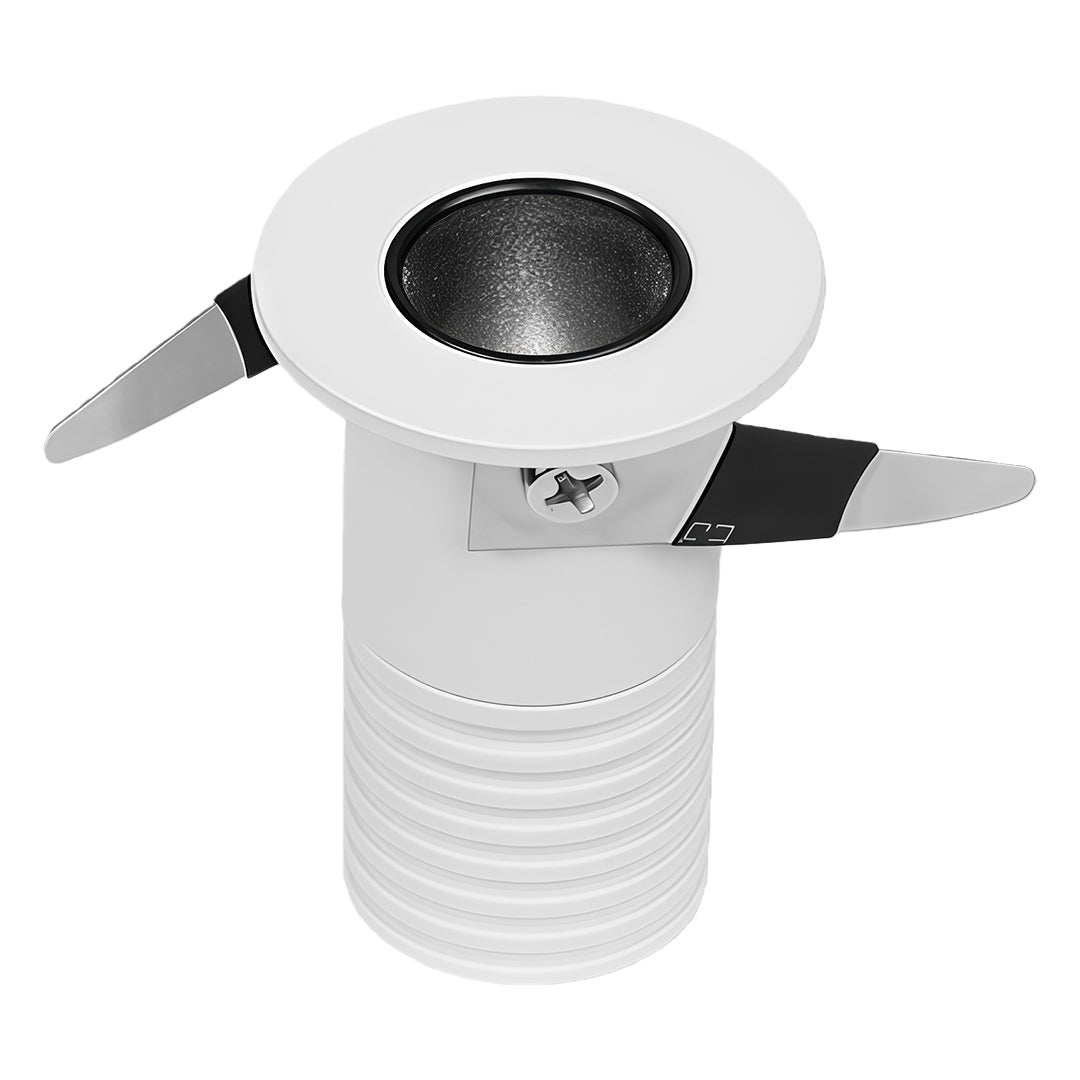 Compact white recessed ceiling spotlight with round bezel and spring-loaded mounting clips
