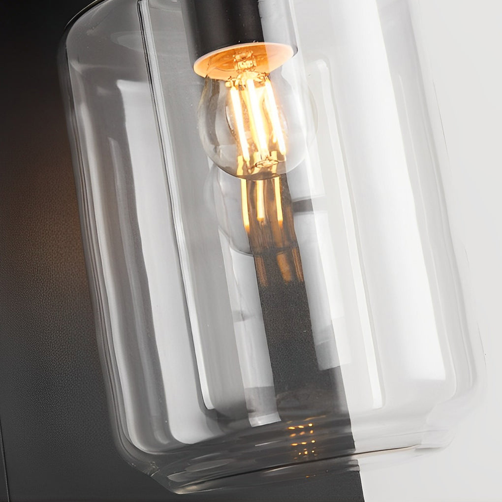 Compound wall lights outdoor with a black finish, providing ambient light near a door.