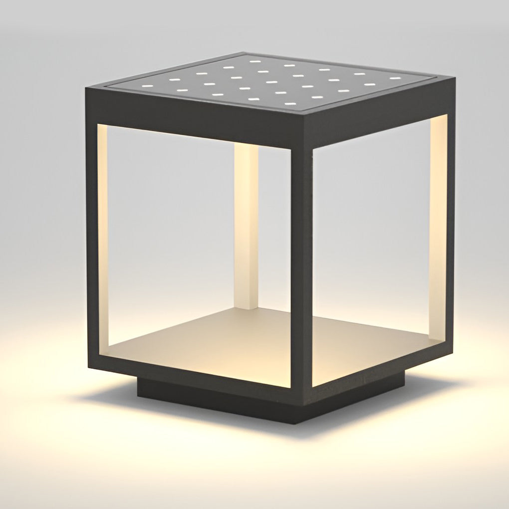 Cube-shaped concrete pillar lights with warm LED glow.