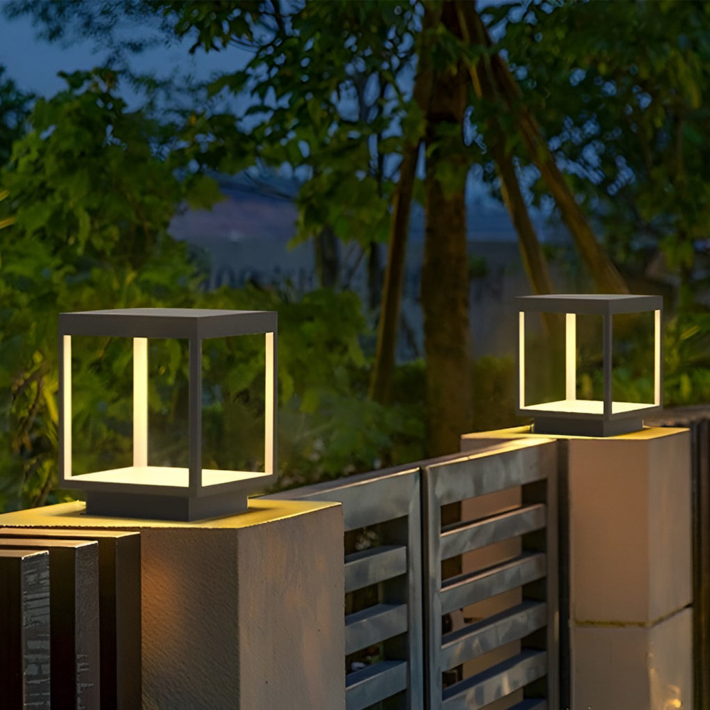 Minimalist concrete pillar lights mounted on a modern fence post.