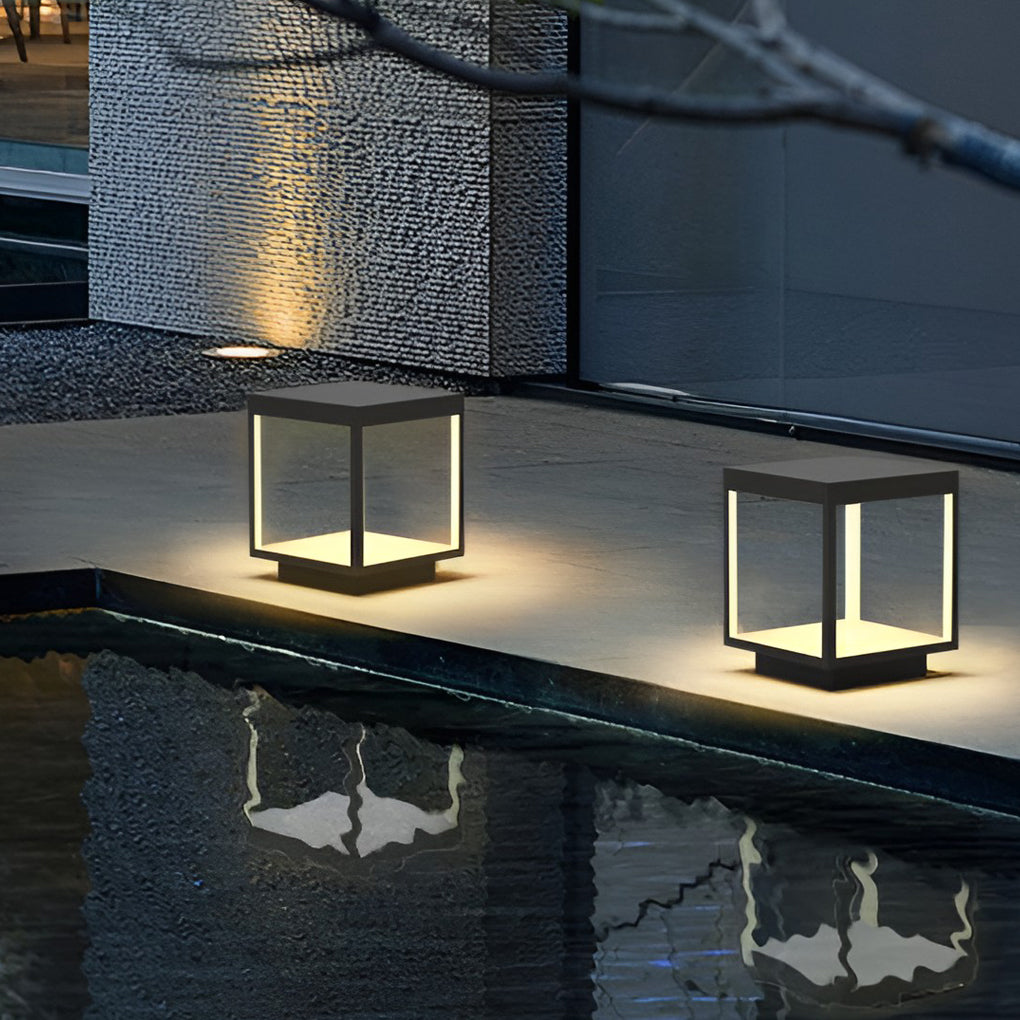 Concrete pillar lights placed on an outdoor patio wall.