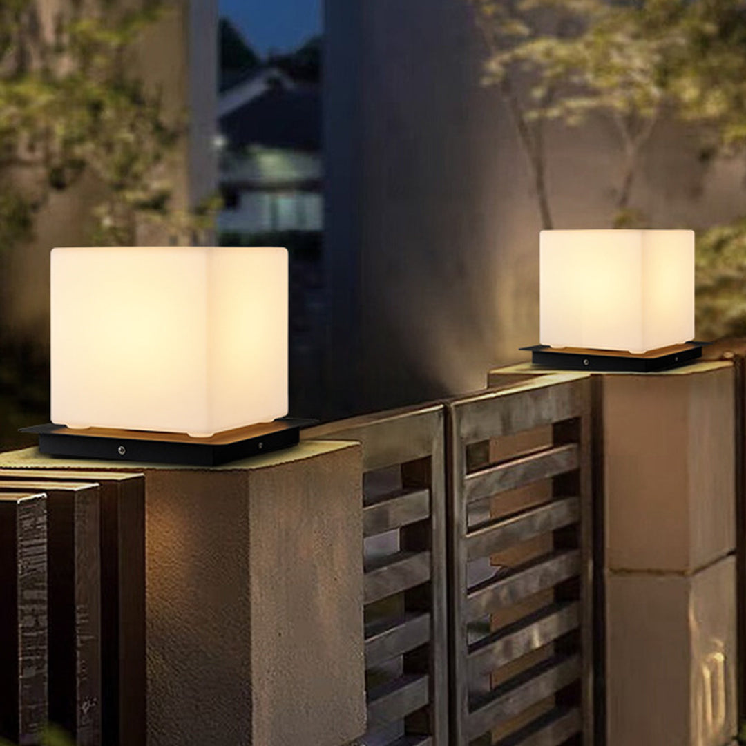 Silver Metal Table Lamp modern cube lights displayed on outdoor concrete surfaces creating elegant contemporary lighting arrangement