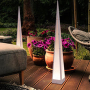 Modern cone-shaped outdoor lights creating ambient lighting on wooden deck patio
