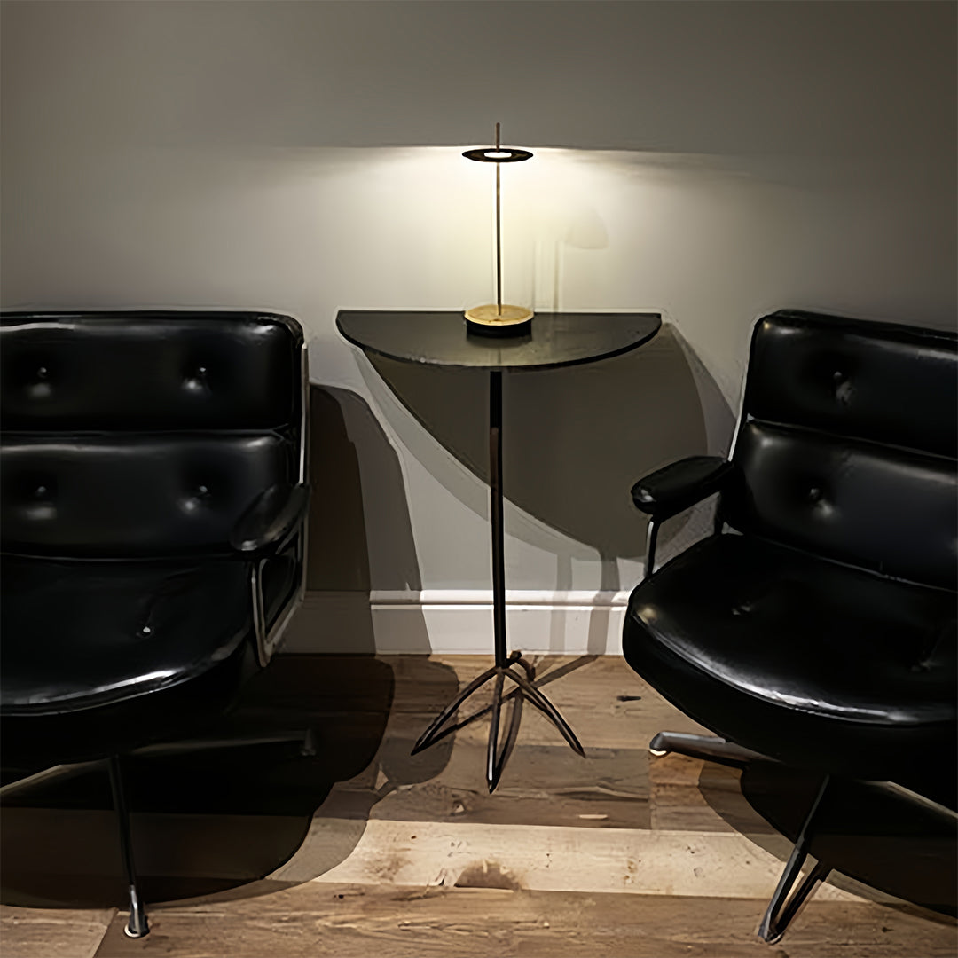 Professional dimmable table lamp positioned in modern conference room with black leather chairs