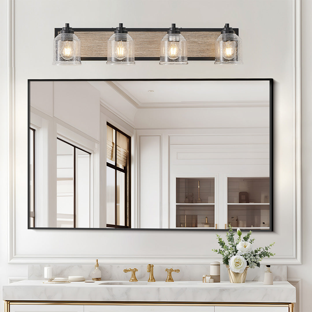Multi-light wall sconce with clear glass shades, installed above a console table for stylish accent lighting.