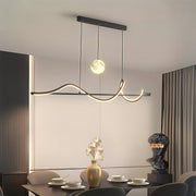 Contemporary art deco pendant light brightening modern dining room with flowing curves and warm LED glow.