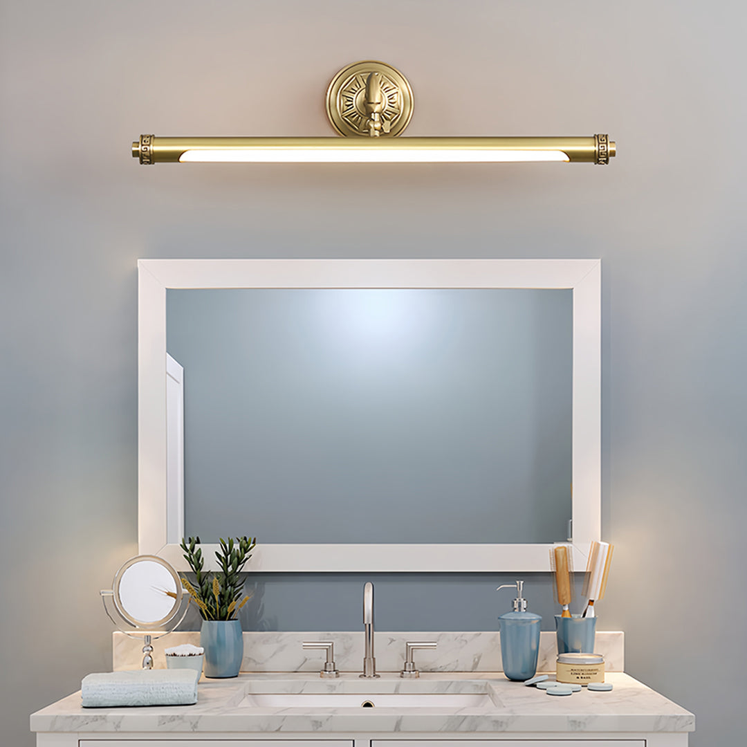 Gold bathroom vanity light illuminating contemporary bathroom with white cabinetry and marble countertop