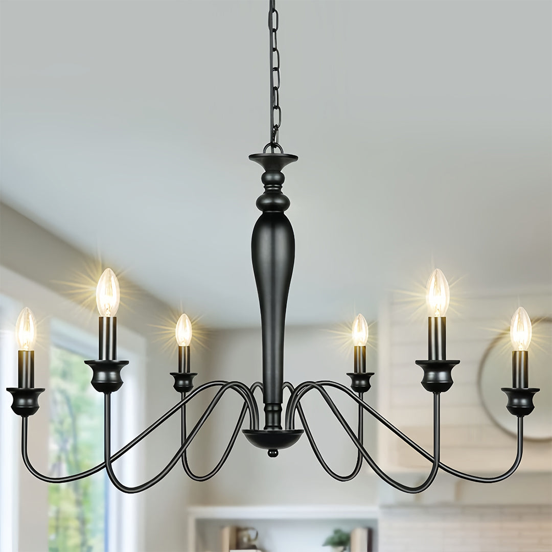 Contemporary black candle chandelier in modern living space with neutral furniture and clean design