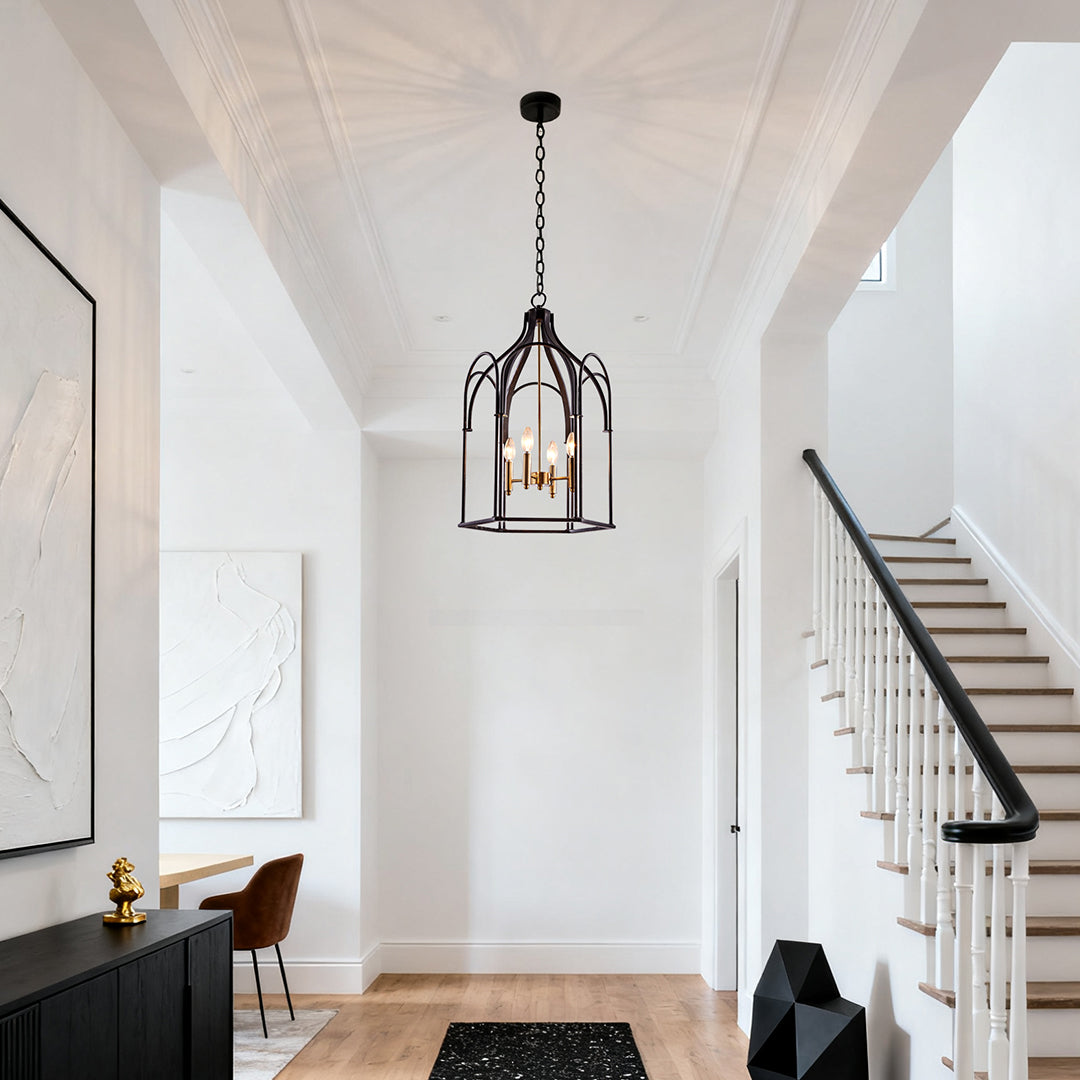 Stylish black metal lantern chandelier with candle-style bulbs in a bright foyer