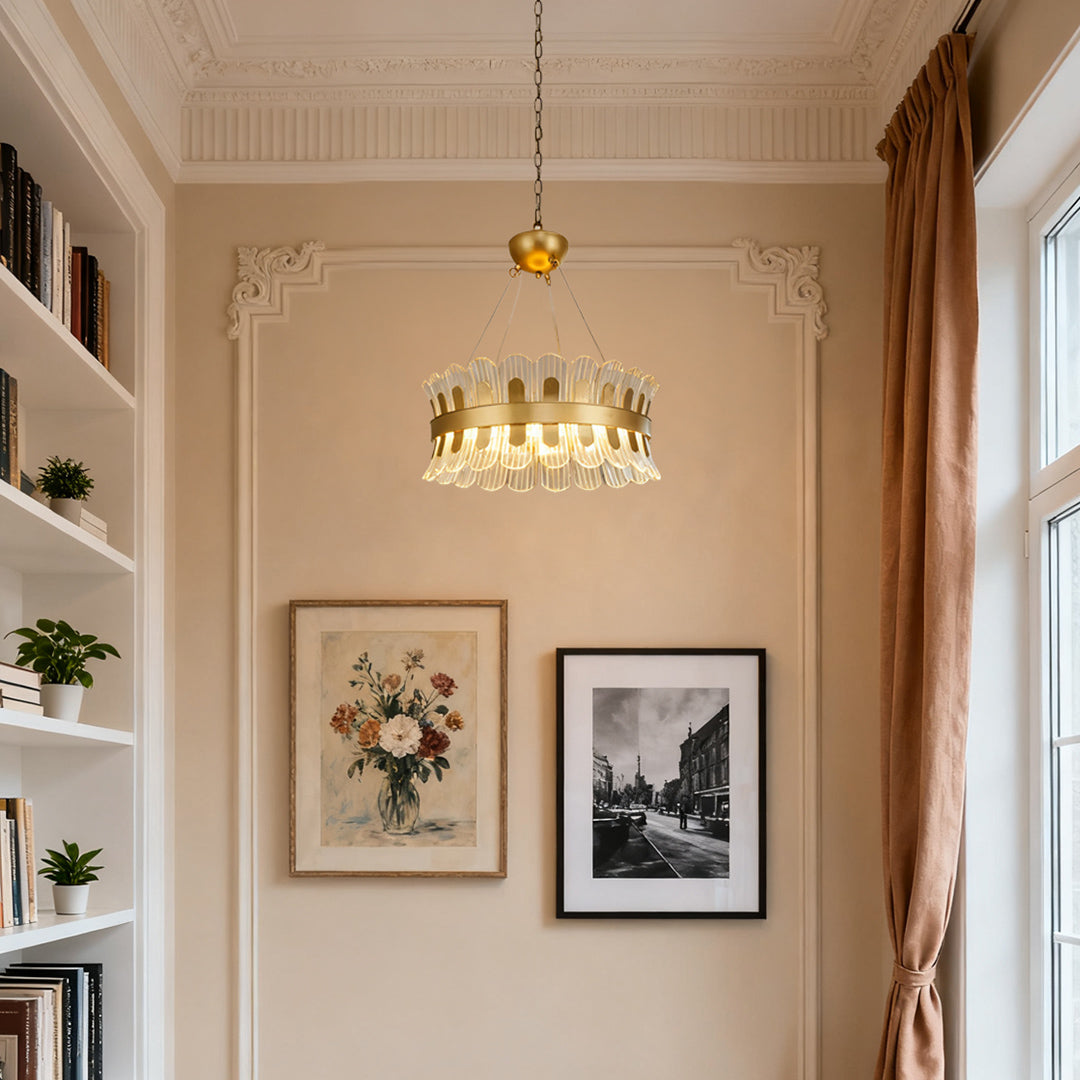 Elegant gold candle-style chandelier in a cozy living room with vintage furniture