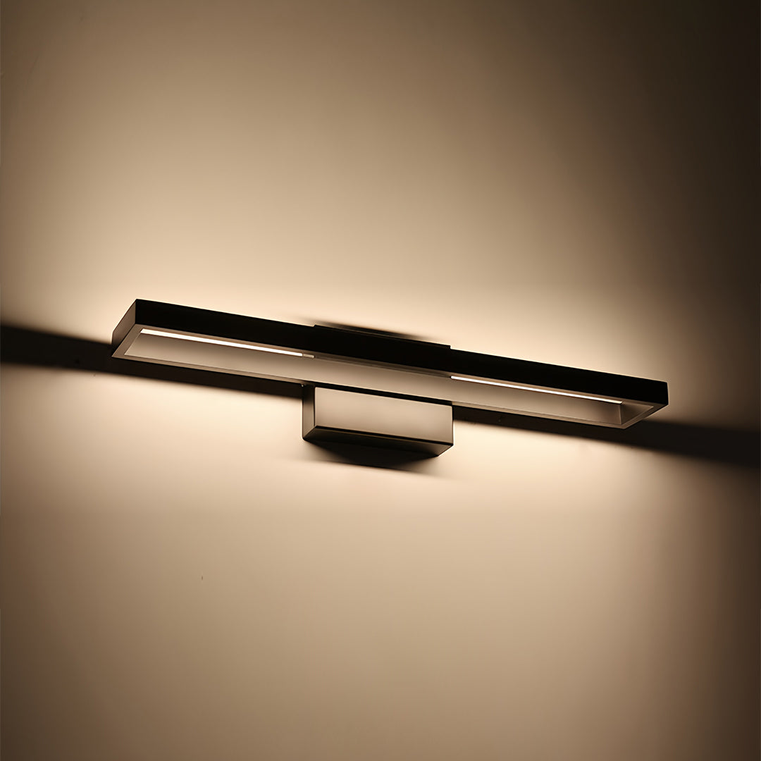 Contemporary black vanity bathroom light with horizontal LED design illuminating artwork display