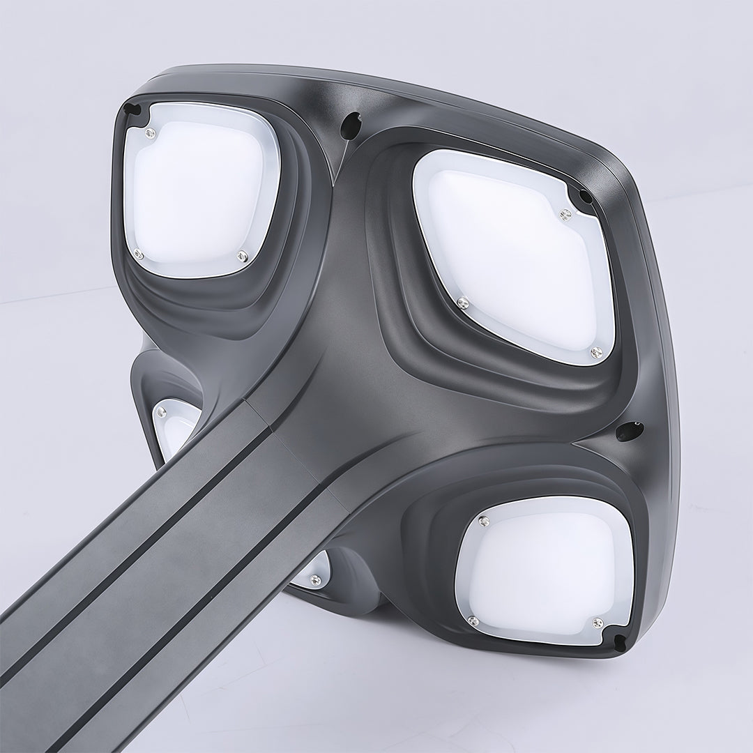 Outdoor black wall light with a contemporary design, placed on a white wall with a sleek look.