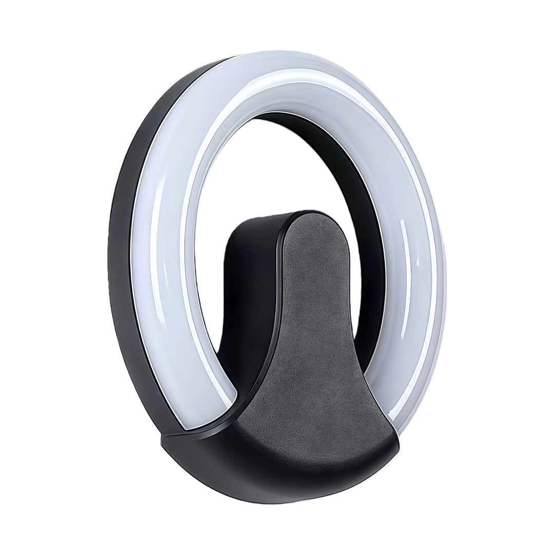 Contemporary black wall sconce light with glass shade chandelier aesthetic in sculptural ring design with artistic center detail.