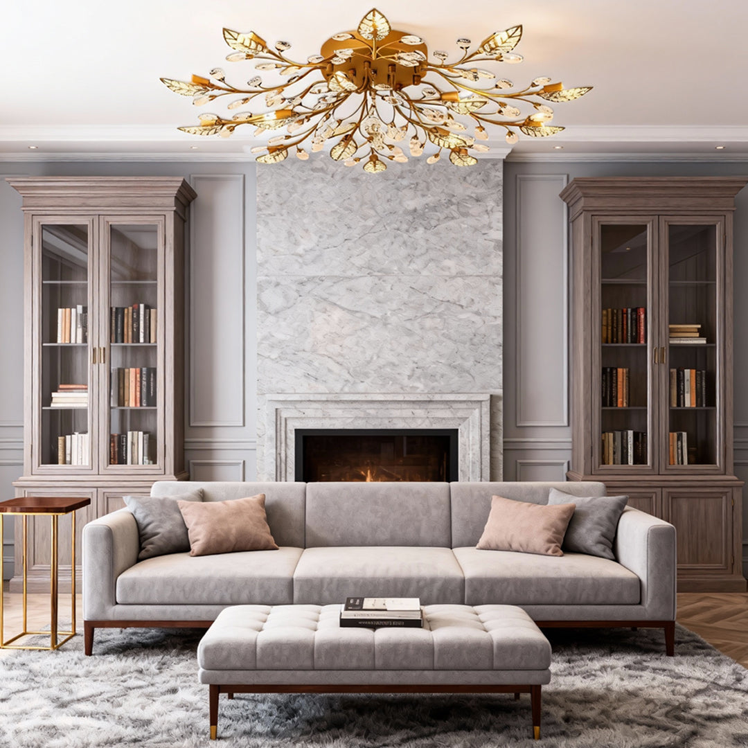 Contemporary brass branch chandelier above a sofa set in an elegant living room setting.