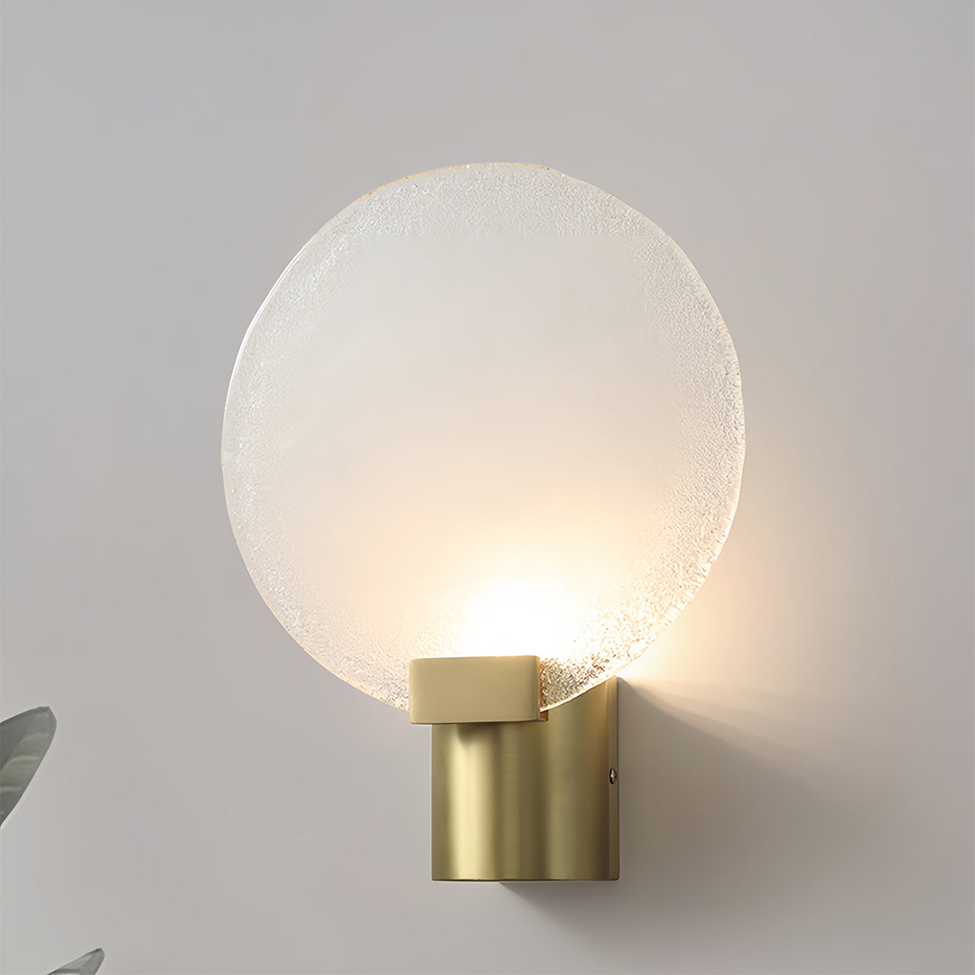 Modern wall lights combining brass elements with clear glass for contemporary interior lighting solutions