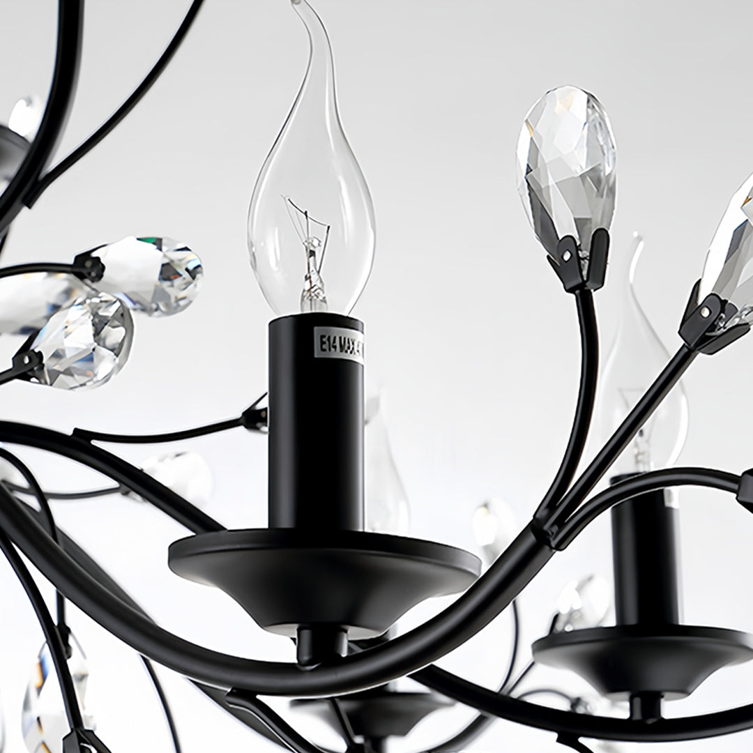 Contemporary candle chandelier with intricate black metal design and multiple candle holders for dramatic lighting