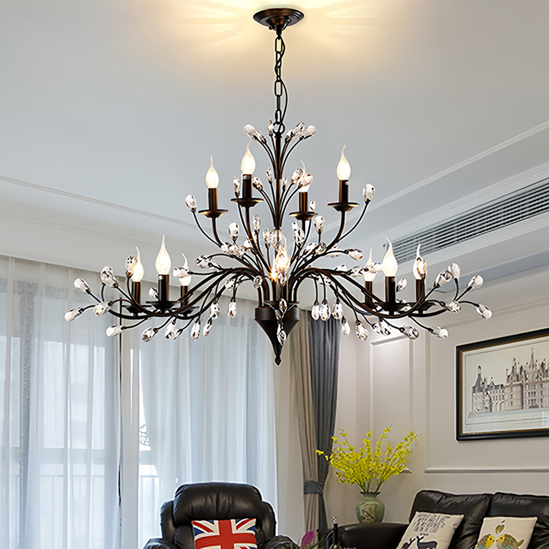Contemporary candle chandelier in luxury living space with blue curtains and sophisticated furniture arrangement