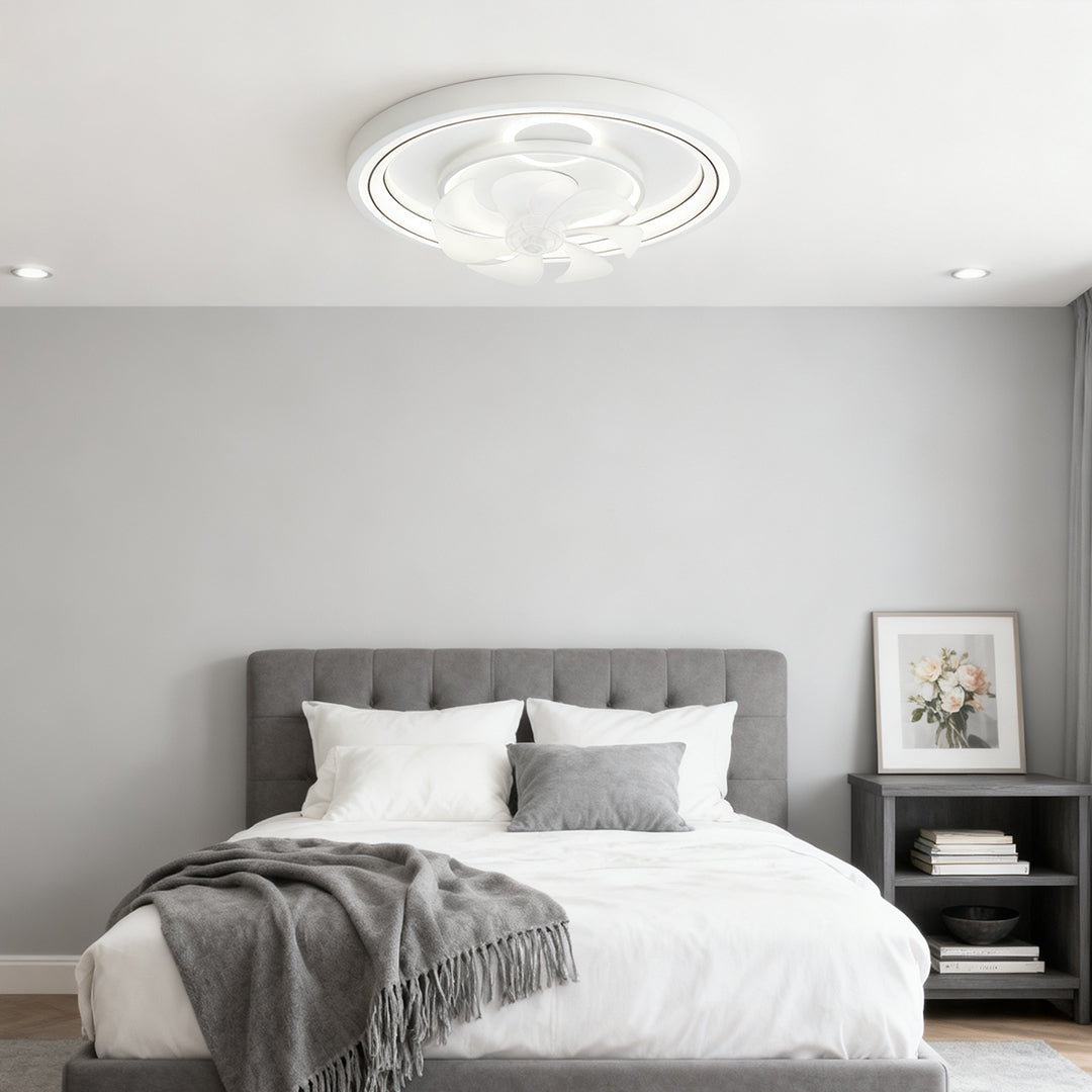 Contemporary ceiling fan with light brightening grey bedroom with tufted headboard and black nightstands