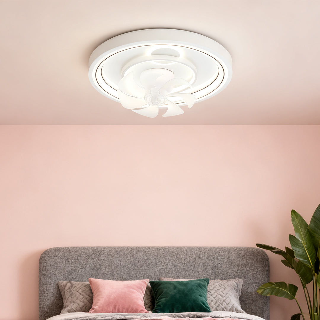 Contemporary ceiling fan with light creating ambiance in pink-accented bedroom with plants and modern decor