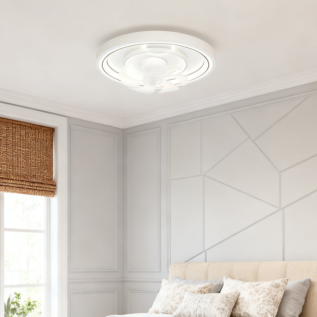 Contemporary ceiling fan with light in elegant white bedroom with wainscoting and soft furnishings