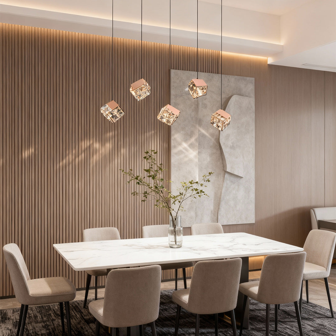Contemporary chandelier with crystals featuring glass shade chandelier styling illuminating minimalist dining area with wood slat accent wall.